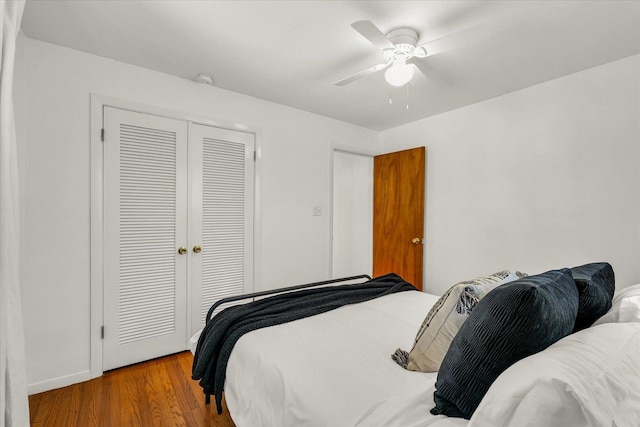 bedroom featuring ceiling fan, a closet, and light hardwood / wood-style floors