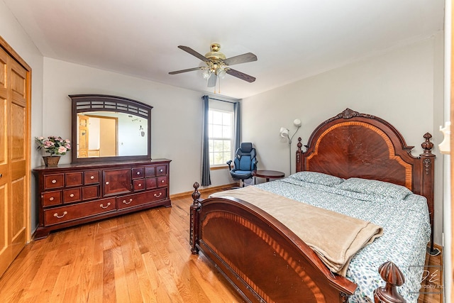 bedroom with light wood-style floors and ceiling fan