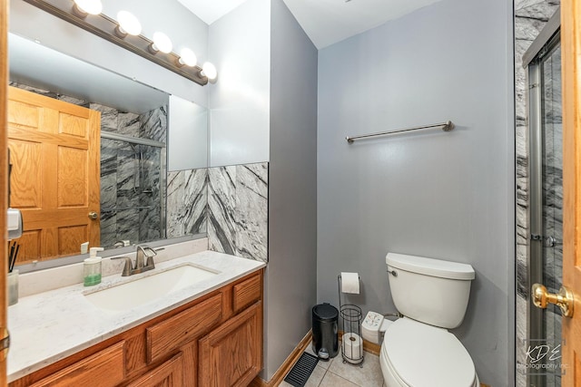 full bath with visible vents, toilet, a shower stall, vanity, and tile patterned flooring