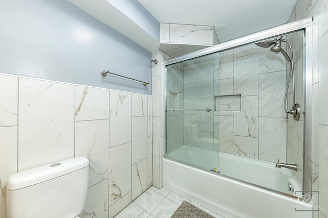 full bath featuring enclosed tub / shower combo, tile walls, and toilet