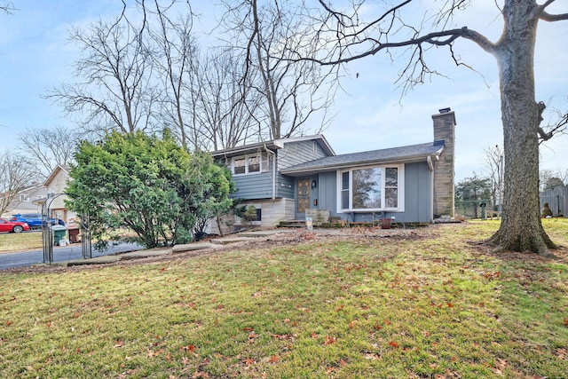 split level home featuring a front lawn