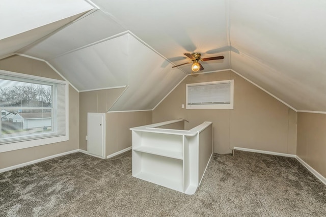 additional living space featuring carpet flooring, ceiling fan, and lofted ceiling