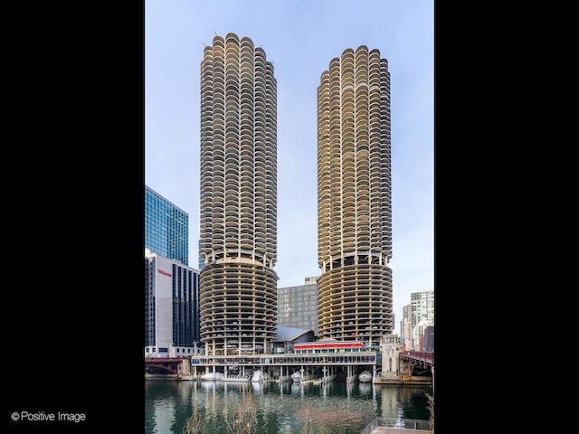 property's view of city featuring a water view