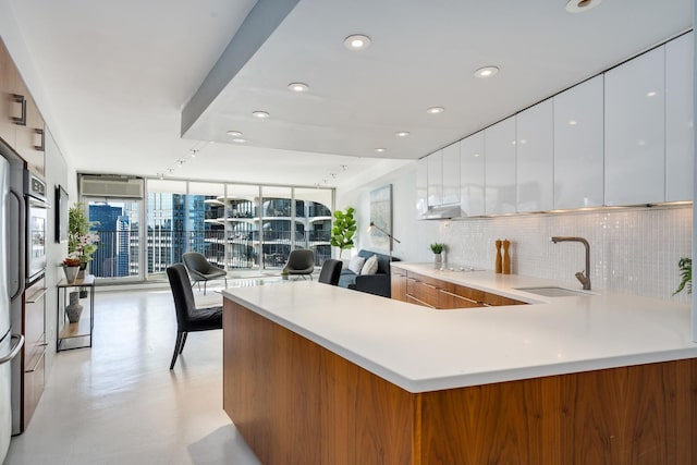 living room featuring concrete floors and a wall mounted AC