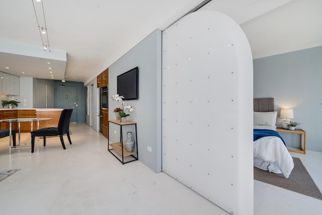 bedroom with a notable chandelier