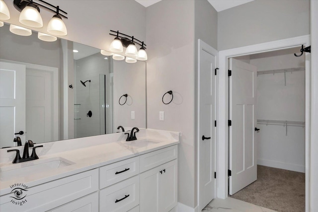 bathroom with vanity and an enclosed shower