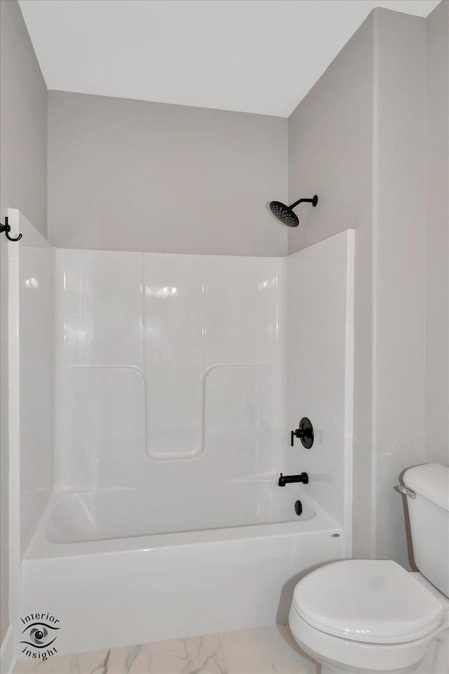 bathroom with toilet and shower / tub combination