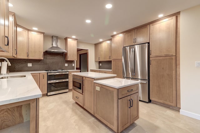 kitchen with appliances with stainless steel finishes, tasteful backsplash, sink, wall chimney range hood, and a center island