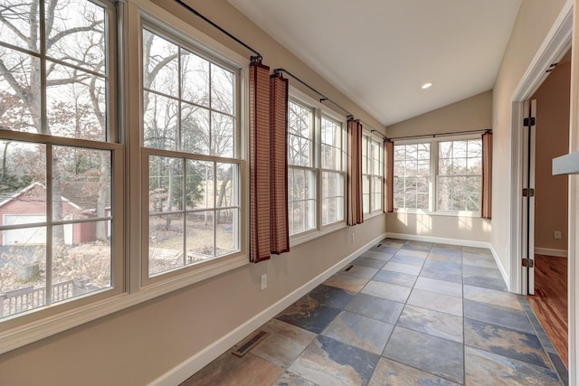 unfurnished sunroom with a wealth of natural light and vaulted ceiling