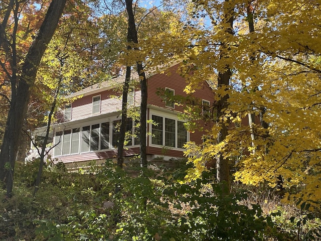 back of house with a sunroom