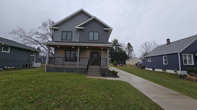 view of front of home with a porch and a front lawn