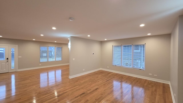 spare room with light hardwood / wood-style floors