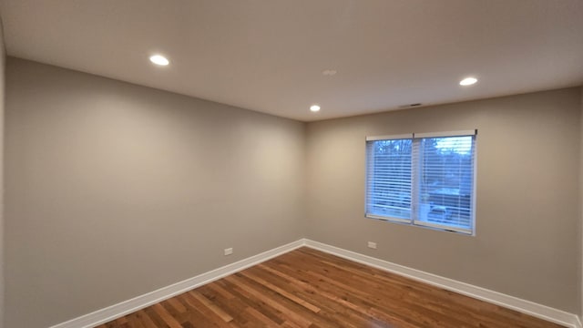 empty room featuring wood-type flooring