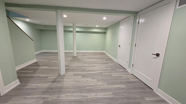 basement featuring light hardwood / wood-style flooring