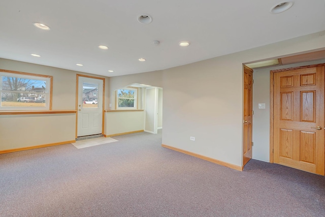 carpeted empty room with plenty of natural light