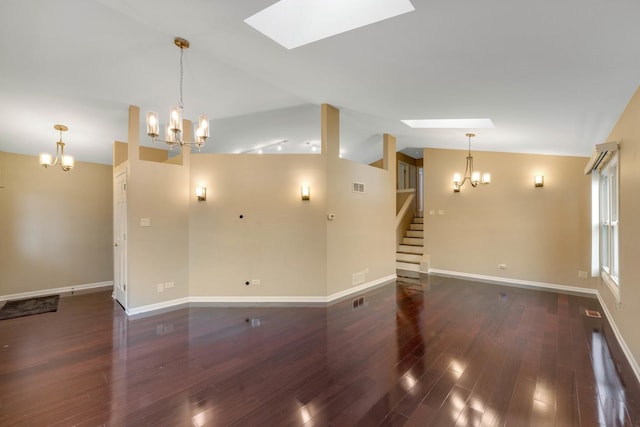 unfurnished living room with lofted ceiling with skylight, a chandelier, and dark hardwood / wood-style floors