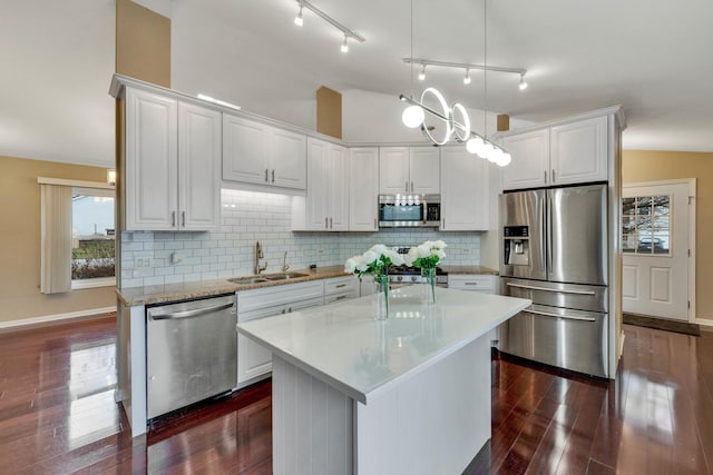 kitchen featuring white cabinets, stainless steel appliances, and sink