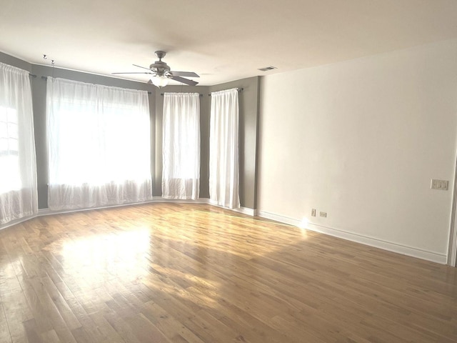 empty room featuring ceiling fan and wood-type flooring