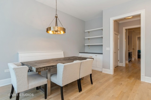 dining space featuring light wood-type flooring