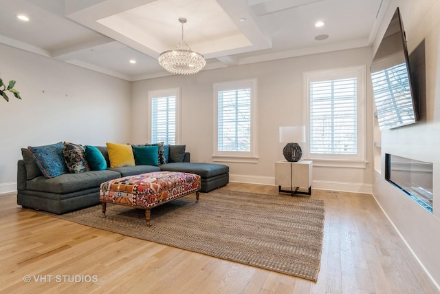 living room featuring an inviting chandelier and hardwood / wood-style floors