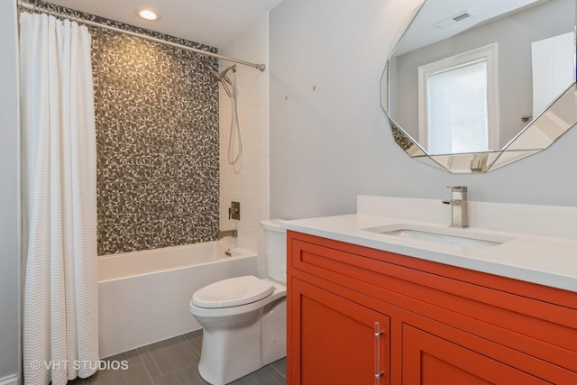 full bathroom with toilet, vanity, tile patterned floors, and shower / tub combo with curtain