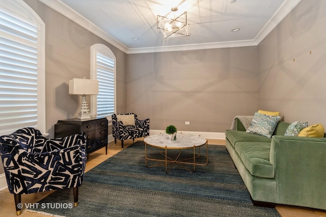 living area with hardwood / wood-style floors and an inviting chandelier