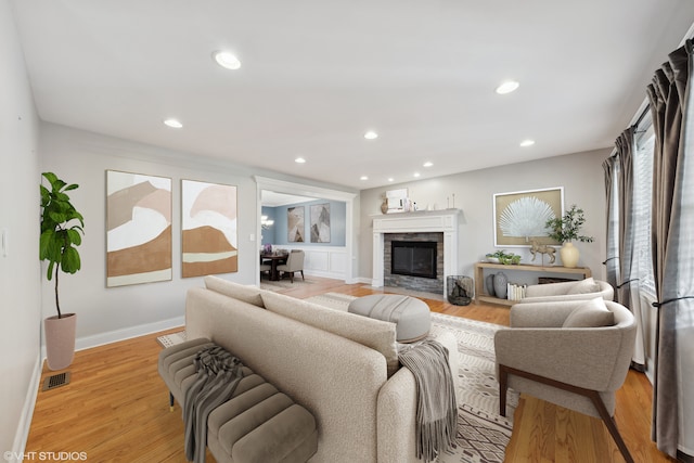 living room with light hardwood / wood-style flooring