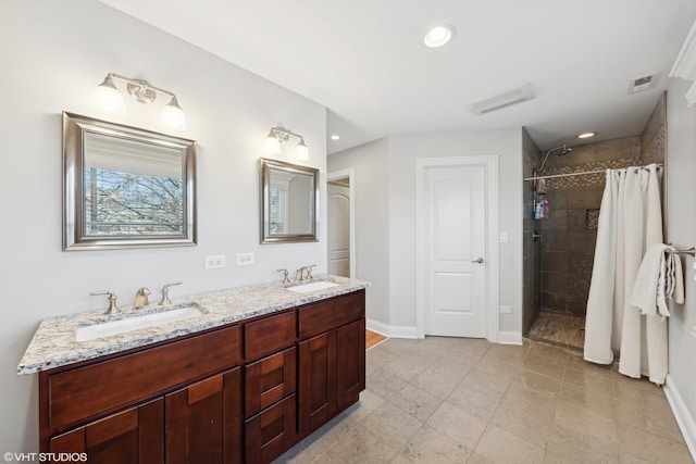 bathroom with a shower with curtain and vanity