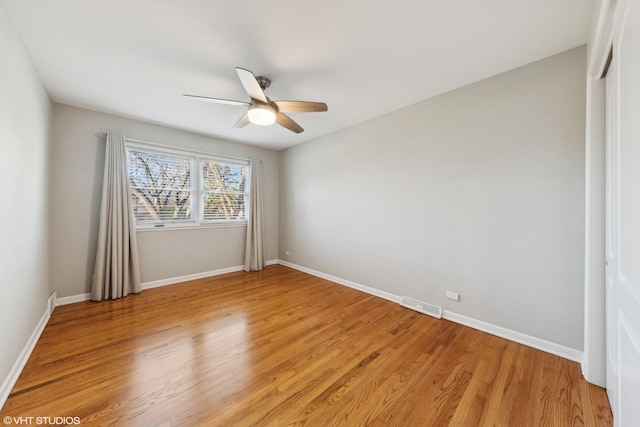 unfurnished room with hardwood / wood-style floors and ceiling fan