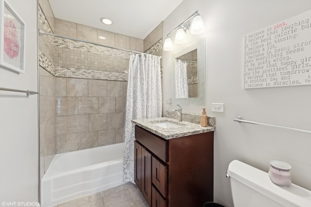 full bathroom with tile patterned flooring, shower / bath combination with curtain, toilet, and vanity