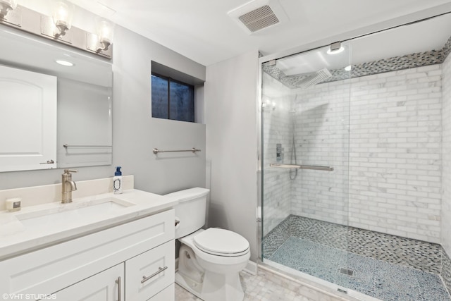 bathroom featuring walk in shower, vanity, and toilet