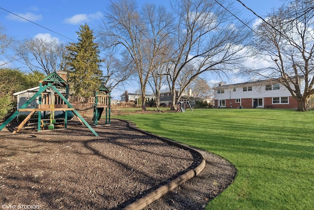 view of jungle gym featuring a lawn