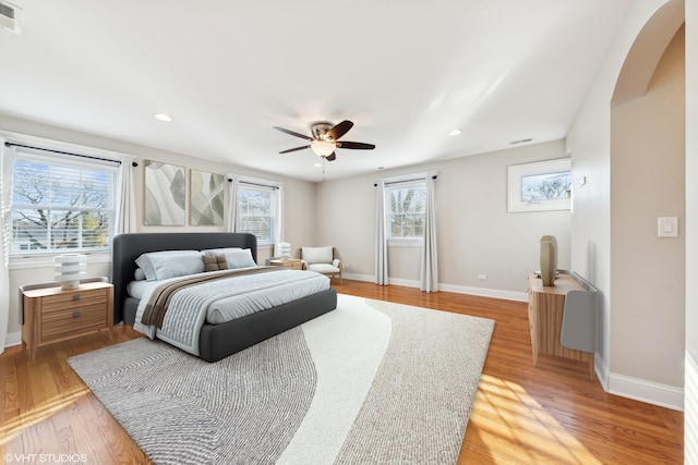 bedroom with hardwood / wood-style floors and ceiling fan