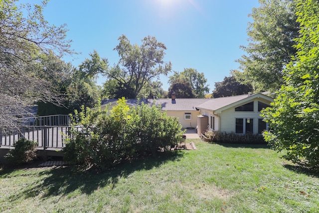 view of yard with a deck