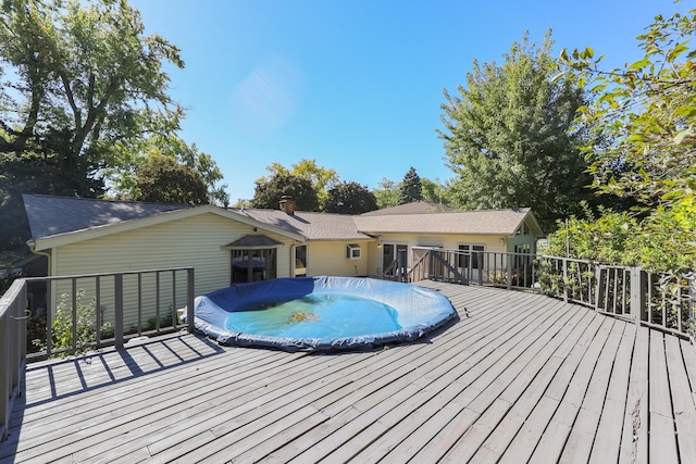 view of pool featuring a wooden deck