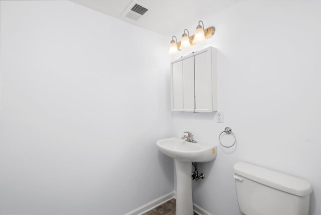 bathroom with toilet and sink