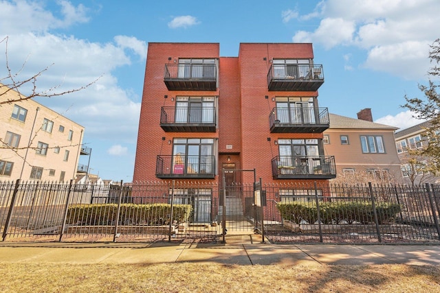 view of building exterior featuring a fenced front yard