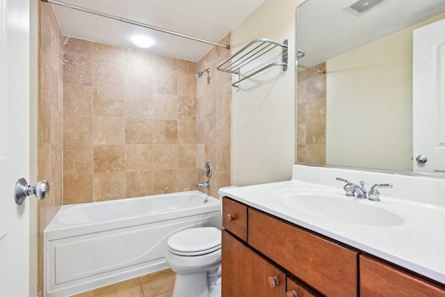 bathroom featuring tile patterned flooring, toilet, vanity, visible vents, and shower / bathing tub combination