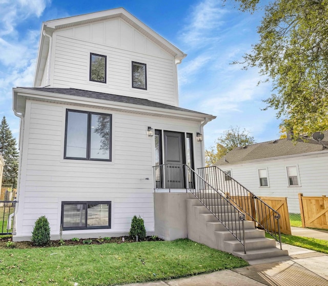 view of front of house featuring fence and board and batten siding