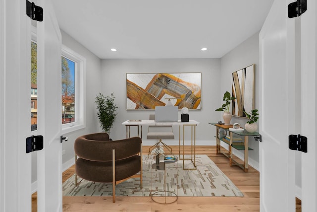 office featuring recessed lighting, baseboards, and wood finished floors