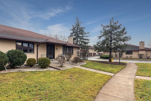 view of front of home with a front lawn