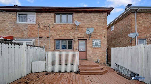 rear view of house with a wooden deck