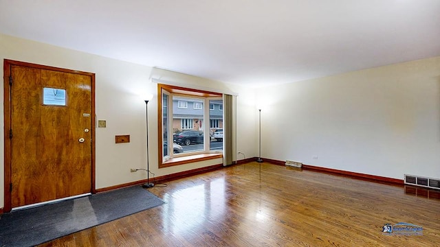 foyer entrance with wood-type flooring