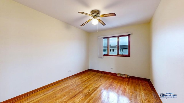 spare room featuring ceiling fan and light hardwood / wood-style flooring