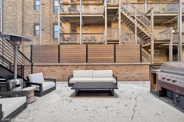 view of patio / terrace with an outdoor living space and grilling area