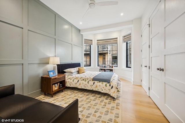 bedroom featuring light wood-type flooring and ceiling fan