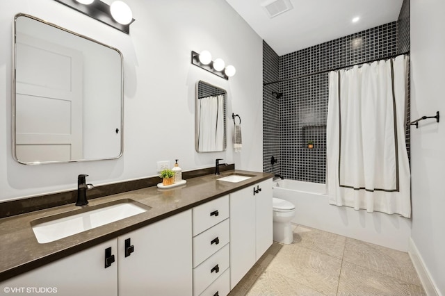 full bathroom with shower / tub combo, vanity, tile patterned flooring, and toilet