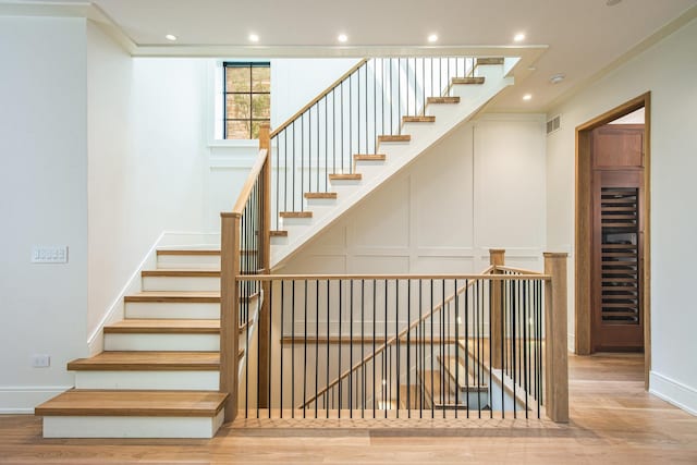 staircase featuring hardwood / wood-style flooring