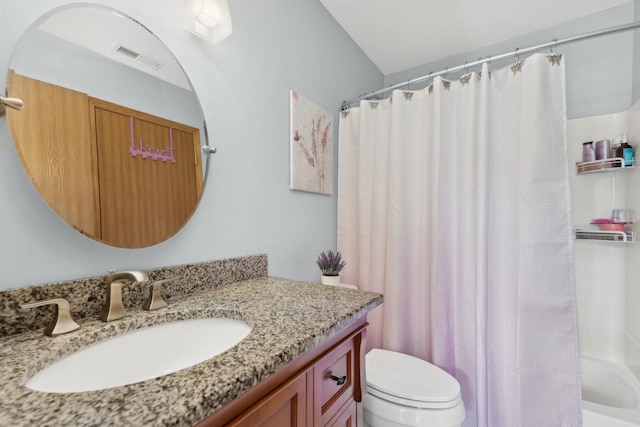 full bathroom featuring shower / bath combo, toilet, and vanity