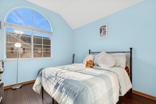 bedroom featuring vaulted ceiling and dark wood-type flooring